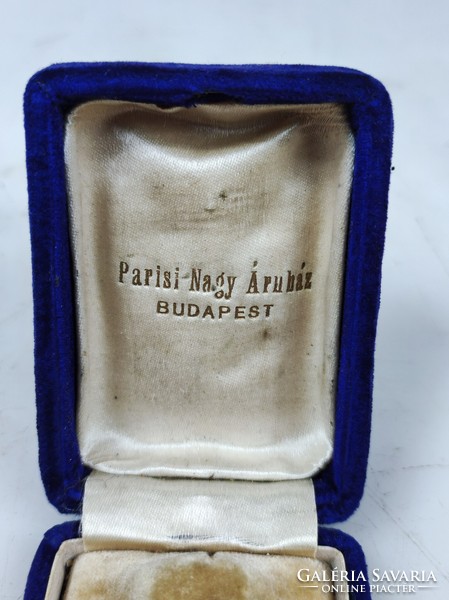 Old famous Pest department store's velvet jewelry box holding a wedding ring pair with the inscription Parisian-great department store