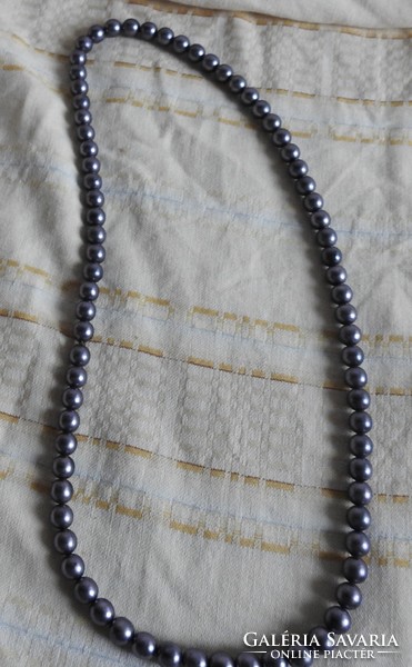 Metallic gray string of beads