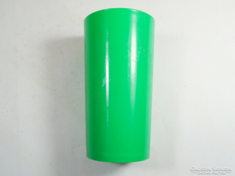 Retro old green plastic toothbrush cup from the 1970s