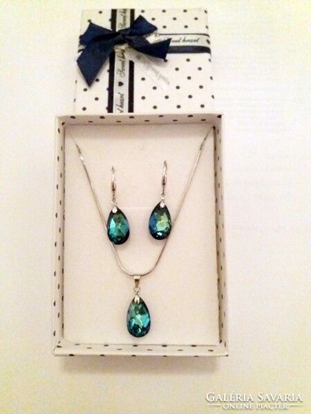 Pair of earrings, necklace, pendant in a shiny blue jewelry box