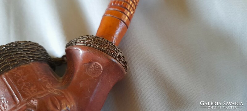 Old ceramic pipe with carved stem