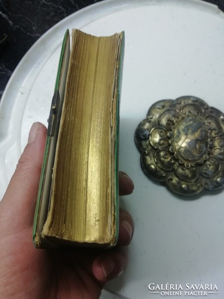 Antique gilded prayer book is in the condition shown in the pictures