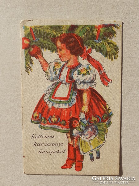 Old Christmas card postcard of a little girl in folk costume with her baby