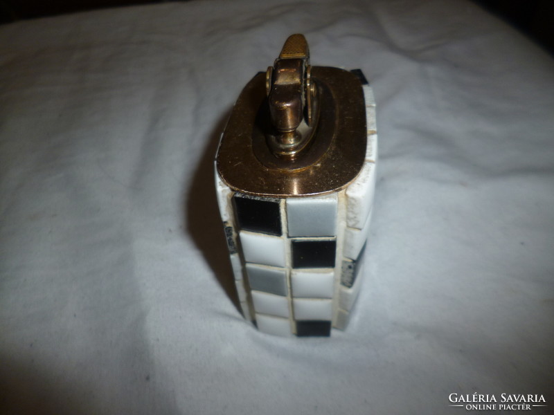 Old gasoline lighter with ceramic decoration