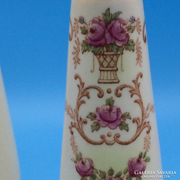 Pair of pink crown ducal English porcelain candle holders with flower baskets