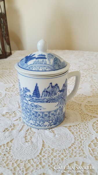 Blue and white porcelain mug with tea filter