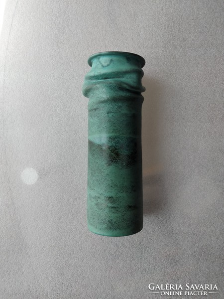 Unmarked green vase with crumpled walls