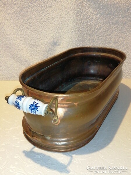 Long, oval shape, porcelain with tongs, copper, pot, decoration, home accessory.