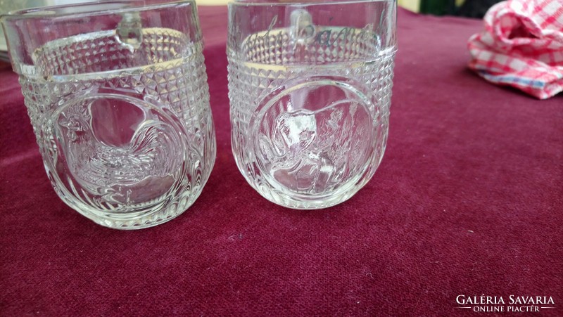 Retro cast glass jugs in a pair decorated with a rooster and an elephant with an upright snout are cute