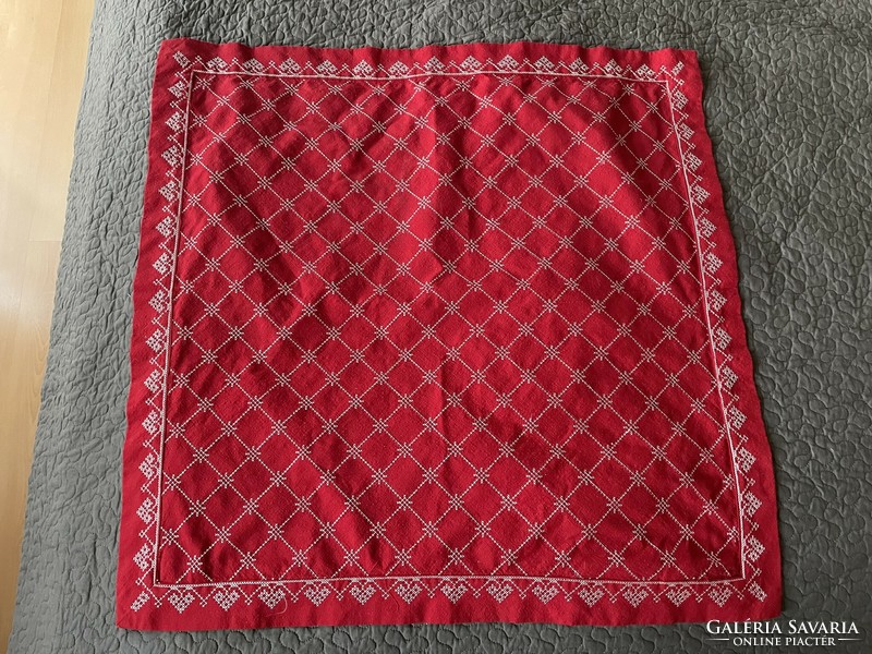 Very nice red placemat with machine cross-stitch embroidery, center of the table