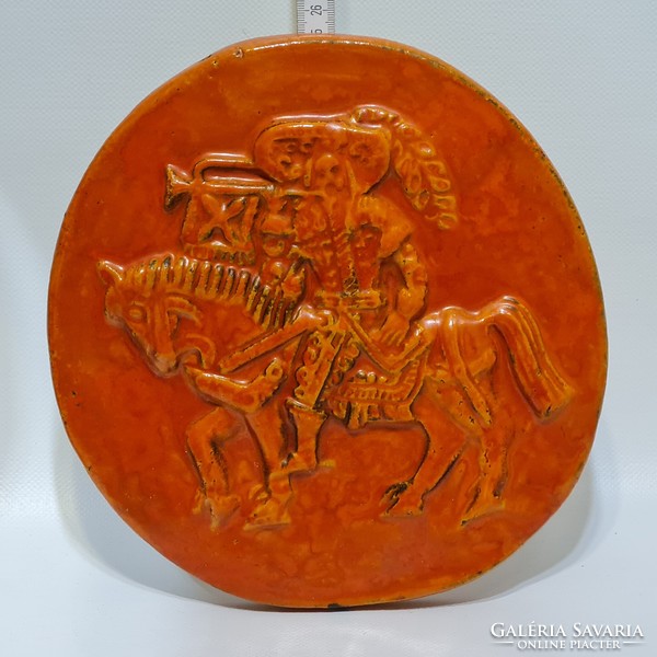 Orange glazed ceramic wall decoration with 
