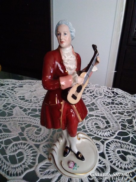 Old royal dux porcelain baroque man with lute, beautiful shades.