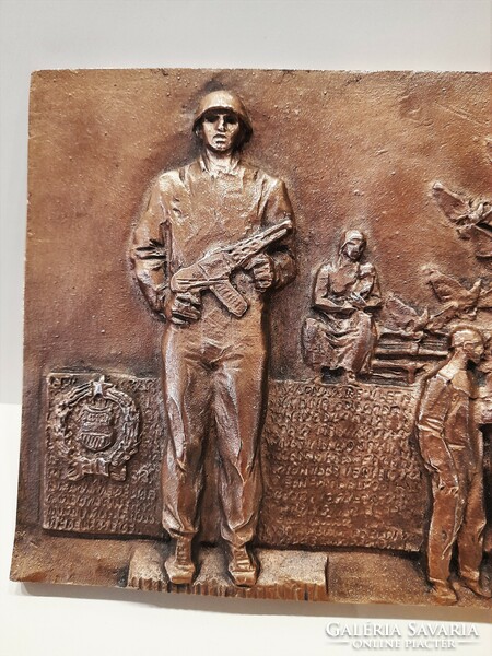 A richly detailed multi-inhabited social realist labor movement bronze relief