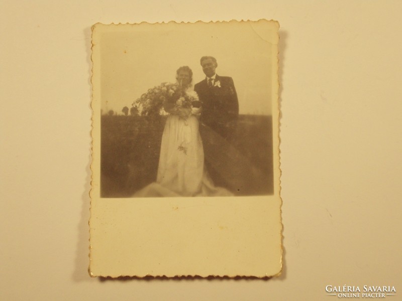Old photo - wedding, groom, bride, bouquet of flowers, field, meadow - 1940s-1950s