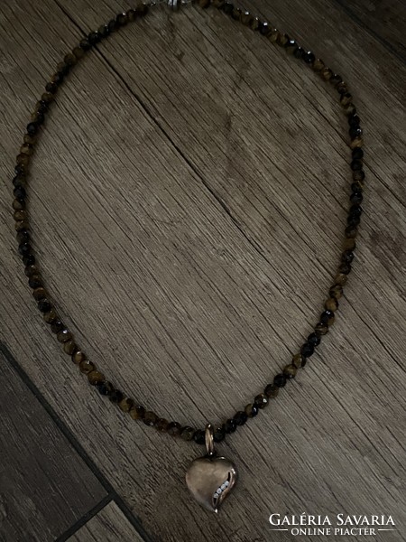 Necklace made of faceted tiger eye pearls with small eyes