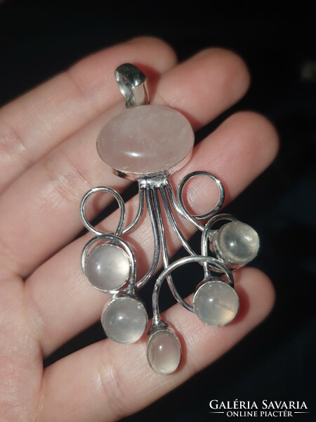 A wonderful rose quartz pendant set in silver, in a unique style