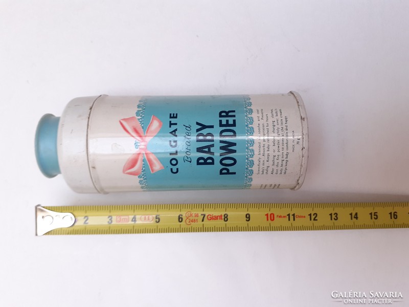 Retro metal can with colgate baby powder in old small bottle