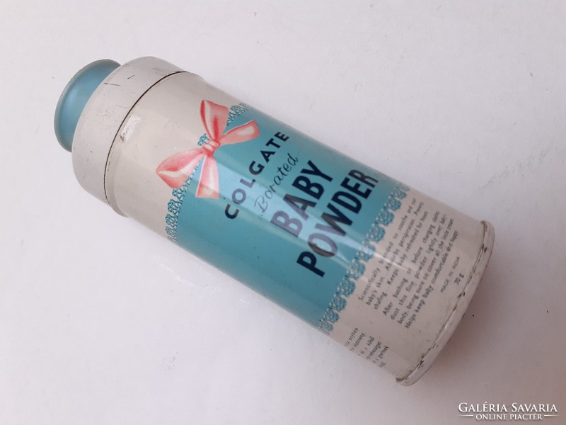 Retro metal can with colgate baby powder in old small bottle