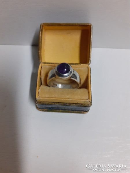 Marked silver ring set with an amethyst stone in its box