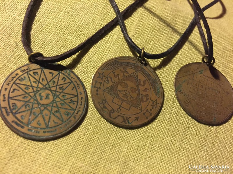 Astrological pendants made of copper, on a leather strap (8 cents)