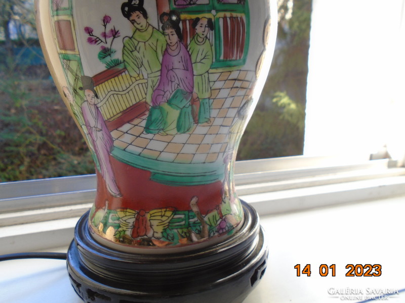 Hand-painted famille rose Chinese lamp with rich gilding, lacquered wood base