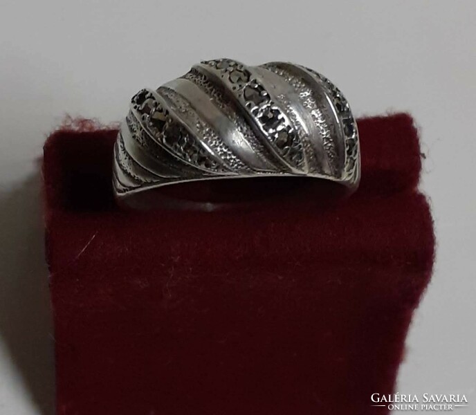 A marked silver ring in good condition set with polished marcasite stones