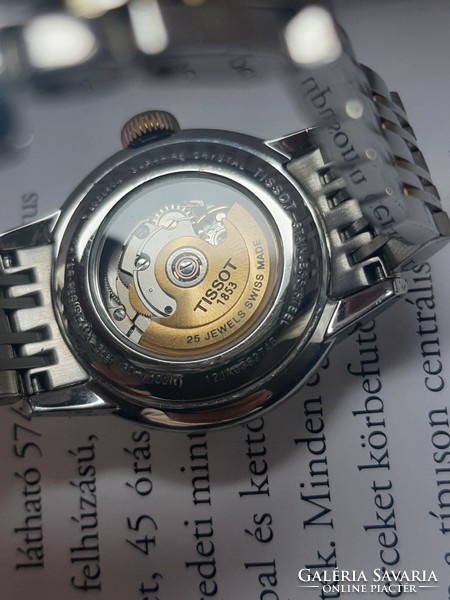 The watch is a Swiss and automatic women's tissot wristwatch