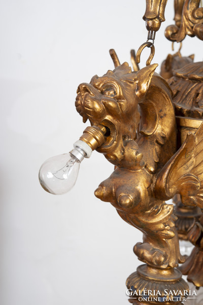 Gilded wooden chandelier - with plastic lion heads