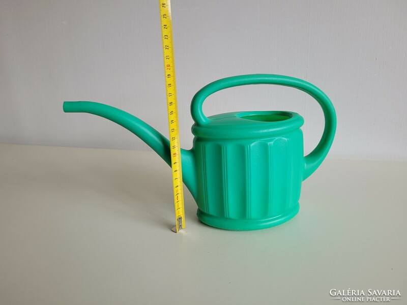 Retro old green plastic watering can watering can watering can