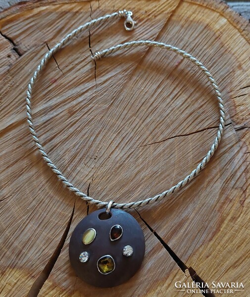 Thick twisted silver necklace with a special round pendant