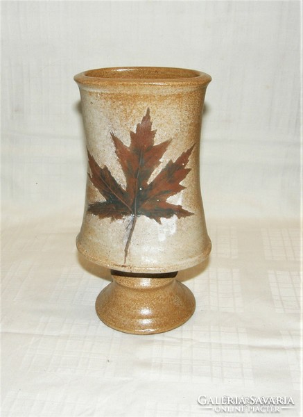 Teresa Szemerek - a special ceramic vase alloyed with leaves.