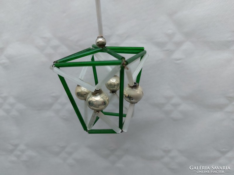 Old glass geometric Christmas tree decoration with green lantern glass ornament