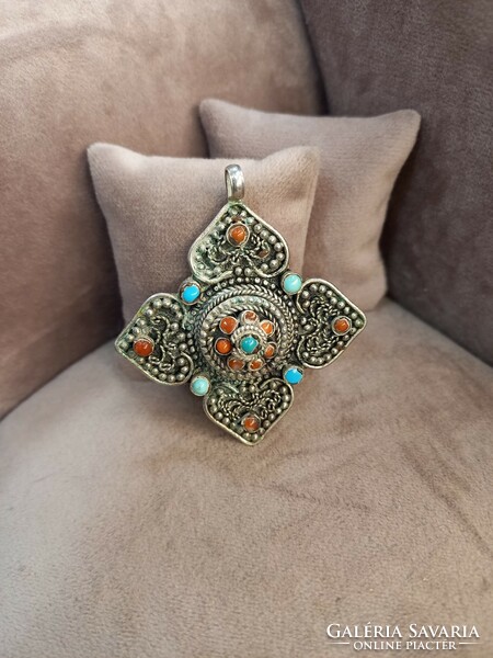 Antique Tibetan silver pendant with stones