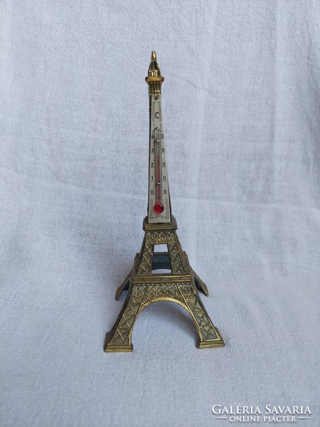 Vintage bronze Eiffel Tower with thermometer