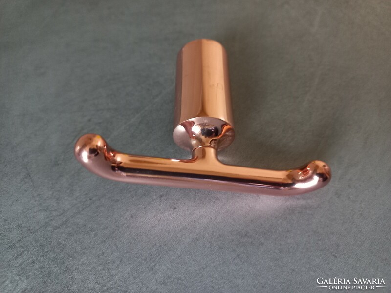 Rose gold-colored two-pronged metal hanger, hanger