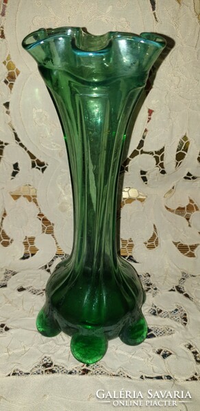 Old torn glass vase