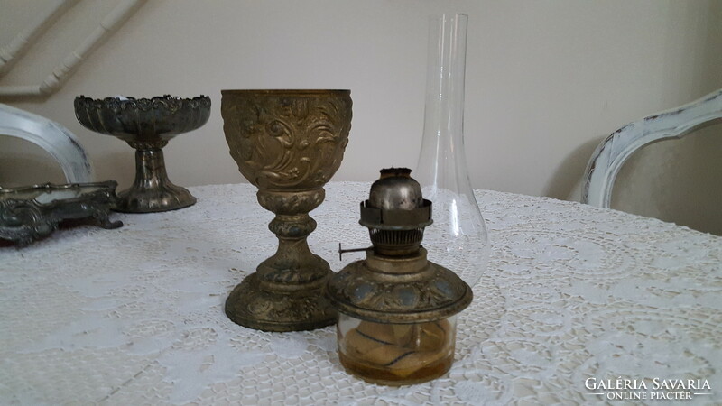 Old, angelic metal kerosene lamp with glass container