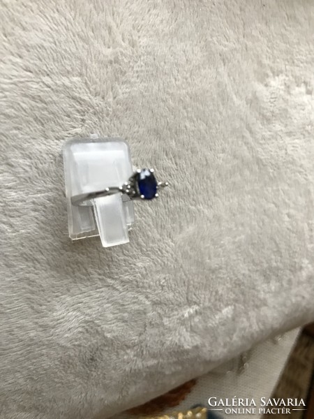 Modern, white gold ring with sapphire and tiny diamonds