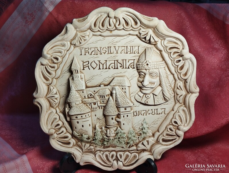 Dracula and his castle on a ceramic plate with a relief pattern