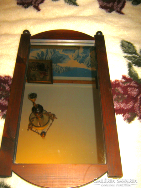 Old wall mirror in a wooden frame