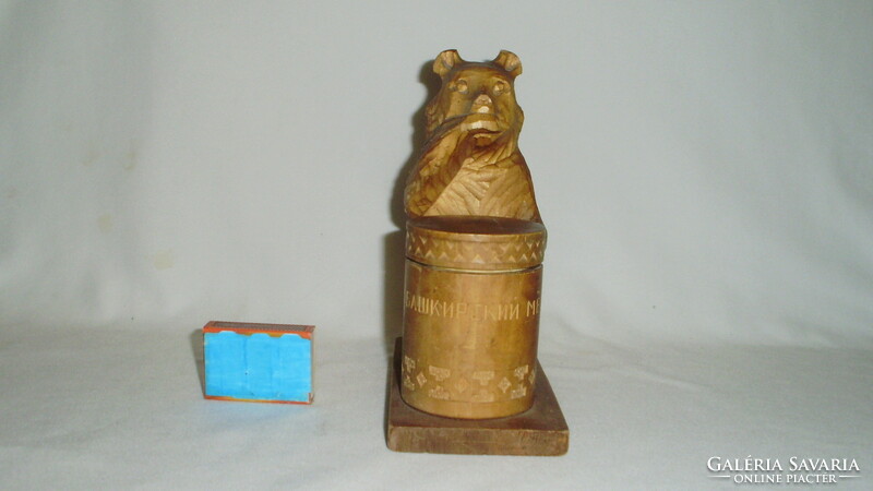 Old Russian carved wooden bear, teddy bear statue on honey pot with small storage