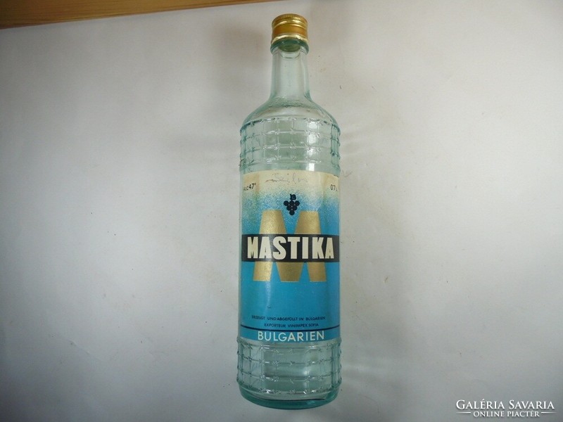 Glass bottle with old paper label - mastika Bulgarian drink - 1980s