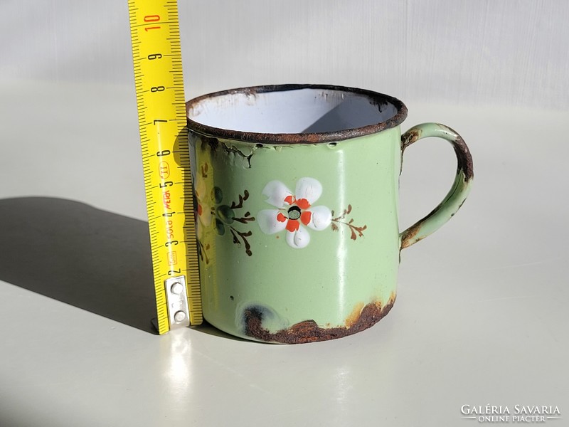Old antique convex patterned floral enameled enamel children's mug from the period of the monarchy