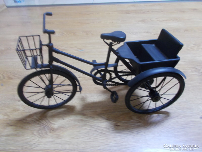Old antique hand-made three-wheel bicycle in original working condition