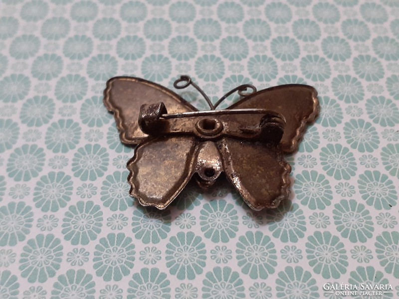Retro enamel brooch with butterfly shaped badge