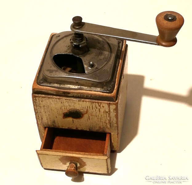 Old coffee grinder with wooden drawer