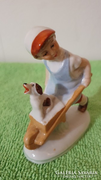Old German mini porcelain figure. Wheelbarrow lad with dog. 8 Cm.