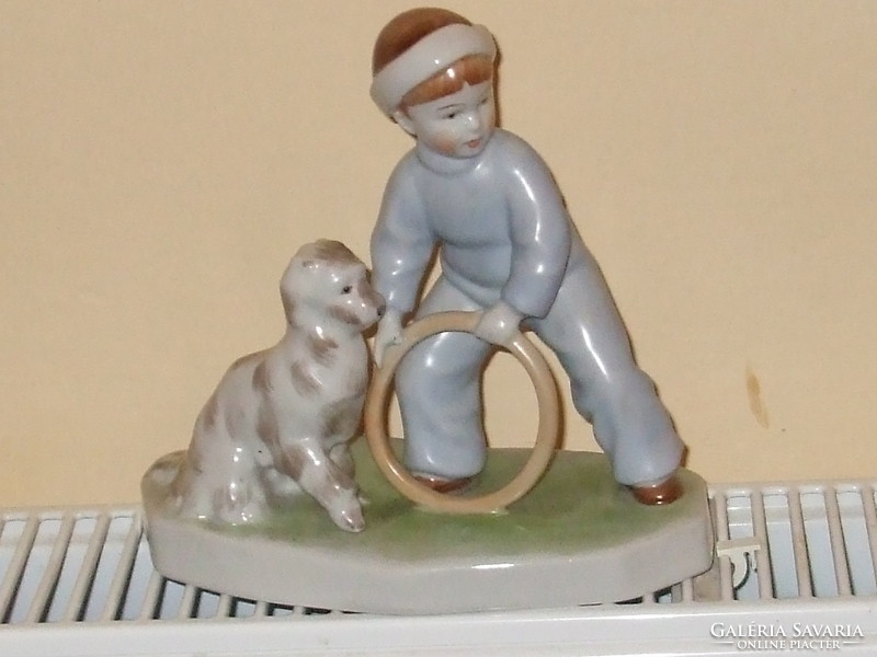 Zsolnay is a boy playing with a dog. Seller!