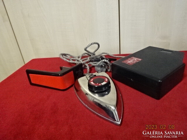 Russian travel iron, in a plastic holder, the length of the ironing board is 16.5 cm. Jokai.