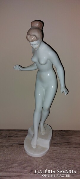 A huge aquincum nude figure entering the water
